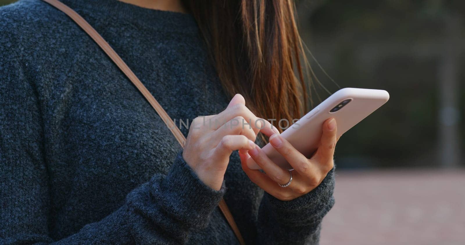 Woman touch on cellphone at outdoor