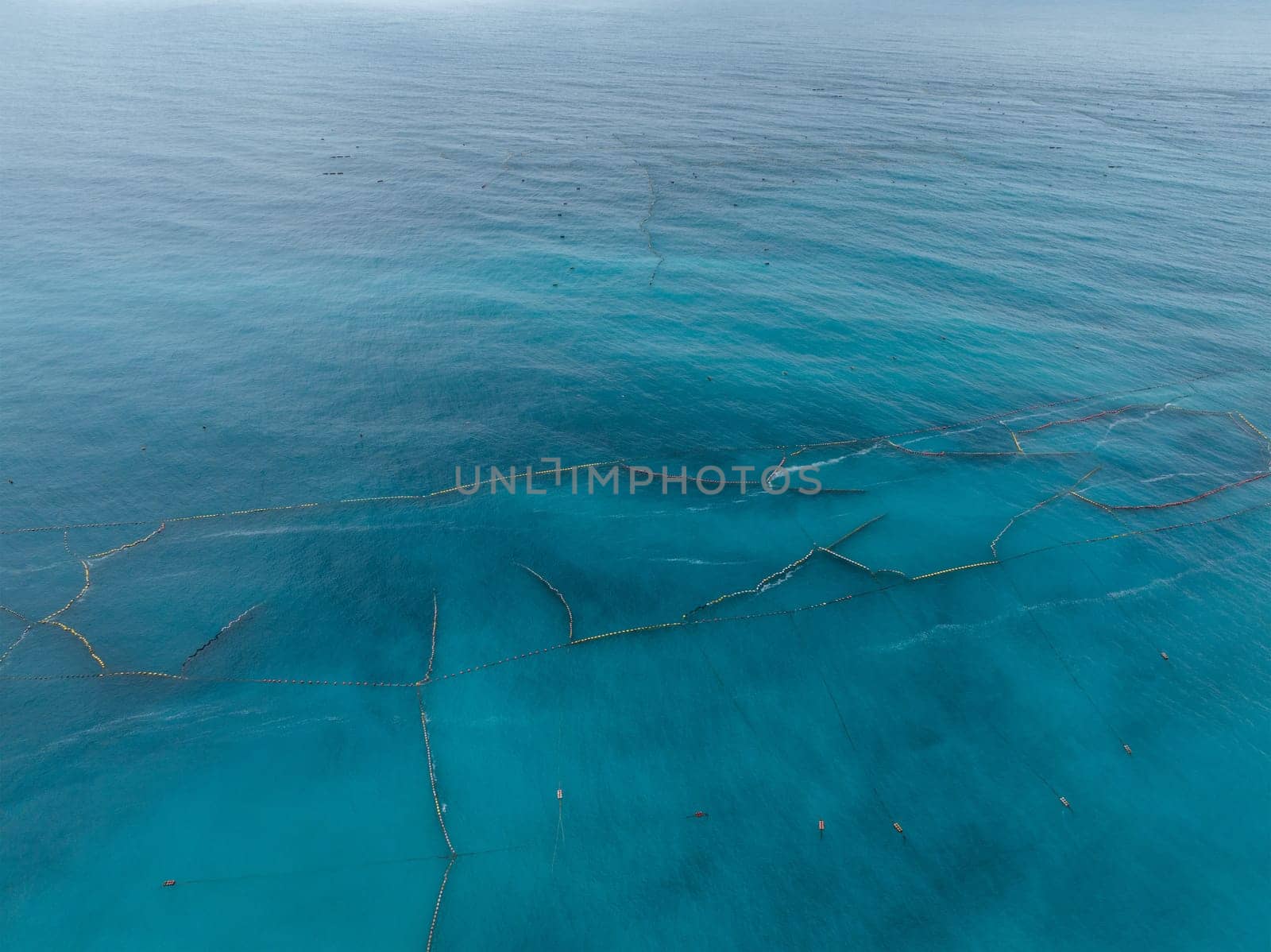 Top view of stationary fishing net over the sea