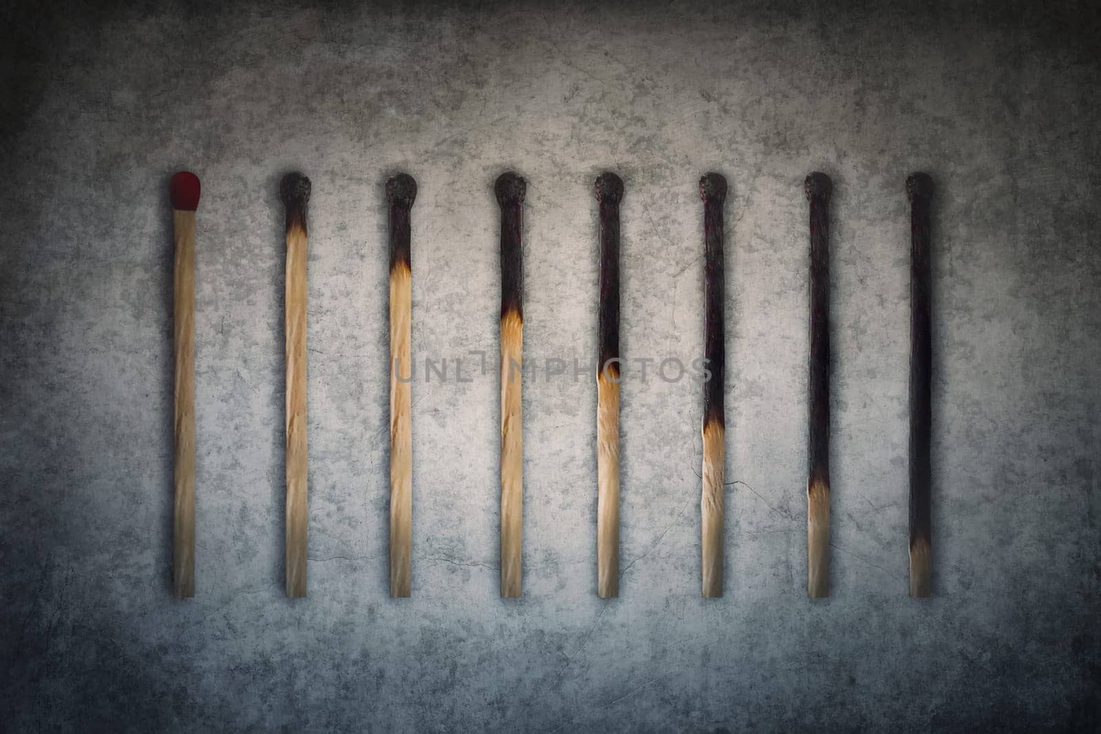 Match sticks burnt at different stages arranged in shape of a decreasing graph or chart. Business decrease conceptual background
