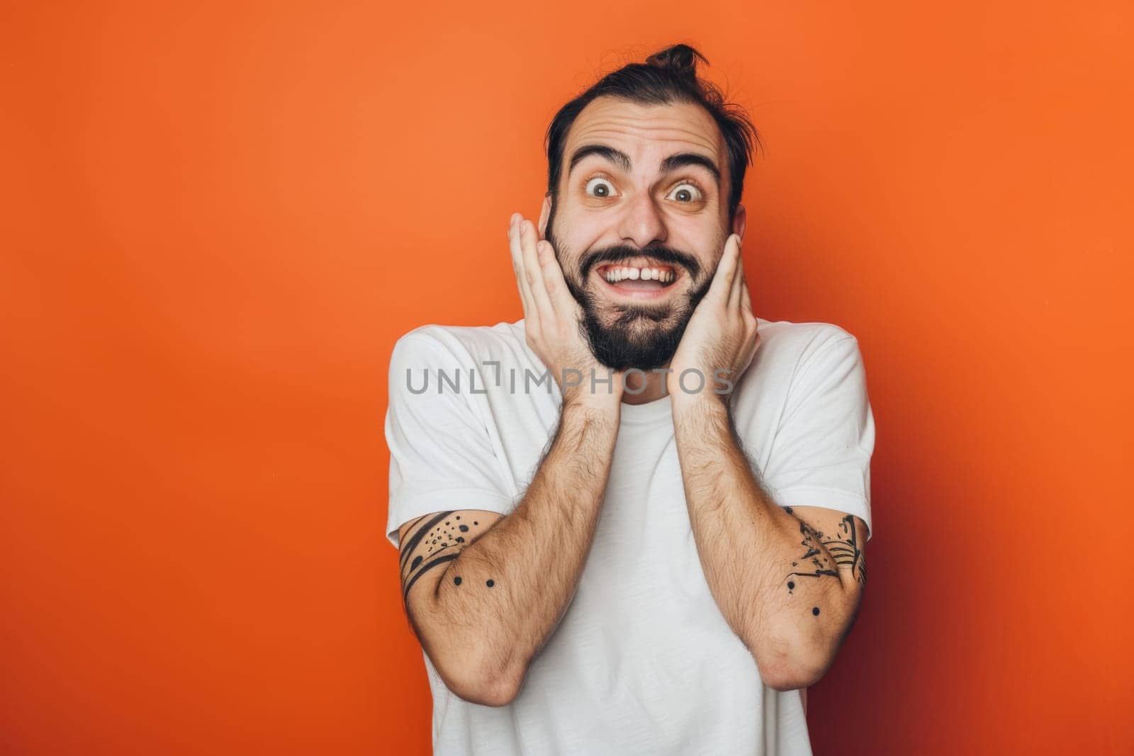 A man is contorting his face with his hands to create a humorous expression. He is using his fingers to pull at his cheeks, stretch his mouth, and squint his eyes comically.