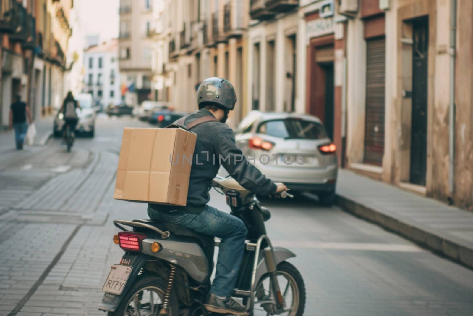 A man is riding a motorcycle with a box securely attached to the back of it. He is navigating the road confidently and focused on his journey.