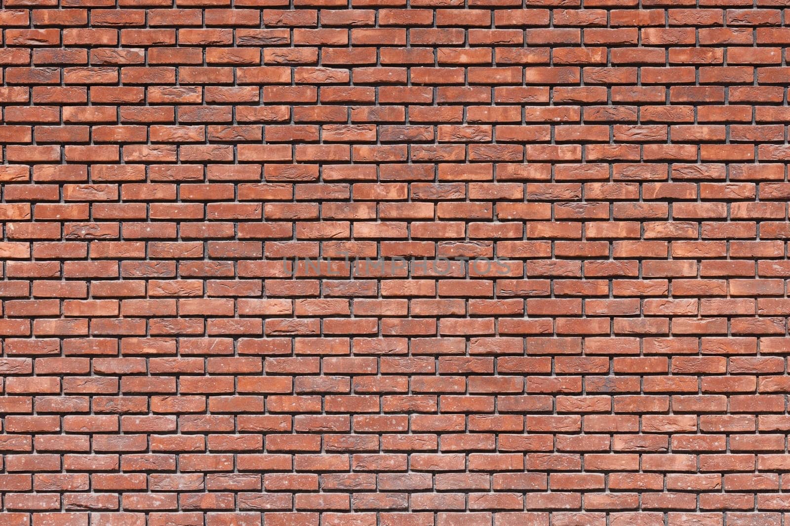 close up of a red brick wall - full-frame background and texture.