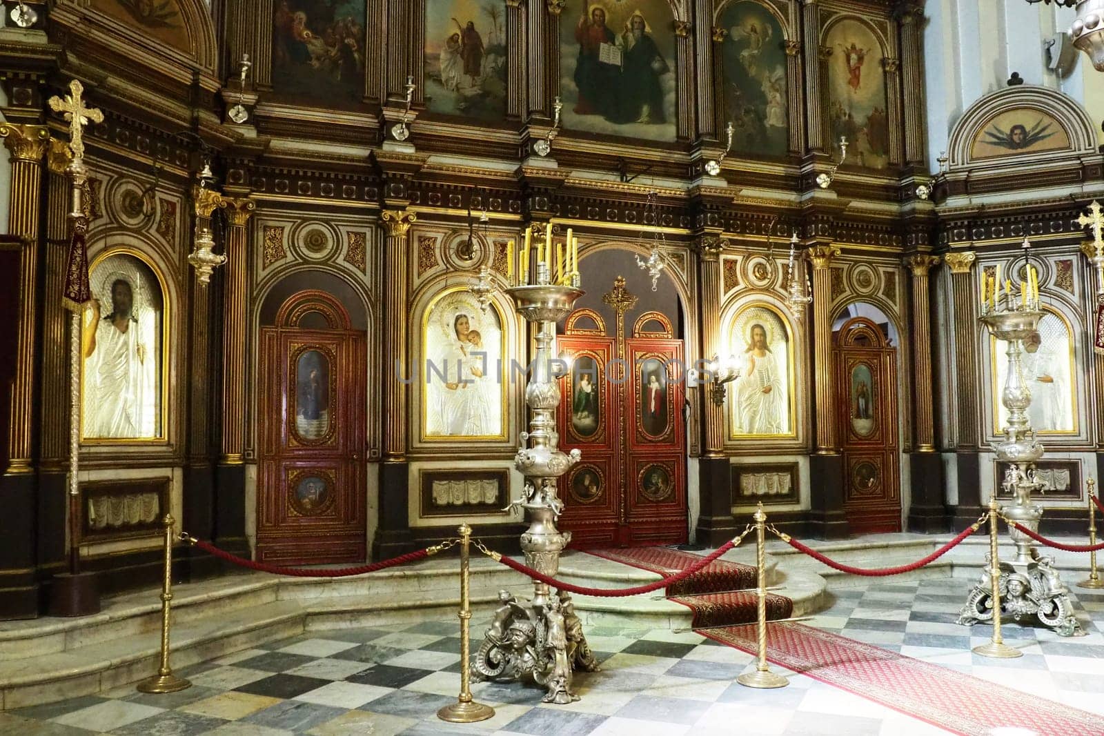 Kotor Montenegro 08.11.22 The Church of St. Nicholas attracts pilgrims tourists. Orthodox center. Interior and decoration of church, altar, icons, candles, chandeliers and antique tiles on the floor