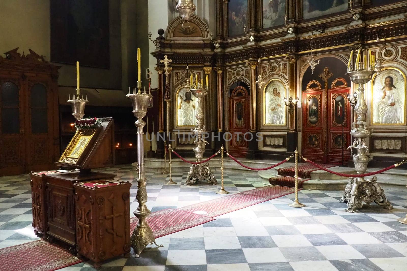 Kotor Montenegro 08.11.22 The Church of St. Nicholas attracts pilgrims tourists. Orthodox center. Interior and decoration of church, altar, icons, candles, chandeliers and antique tiles on the floor