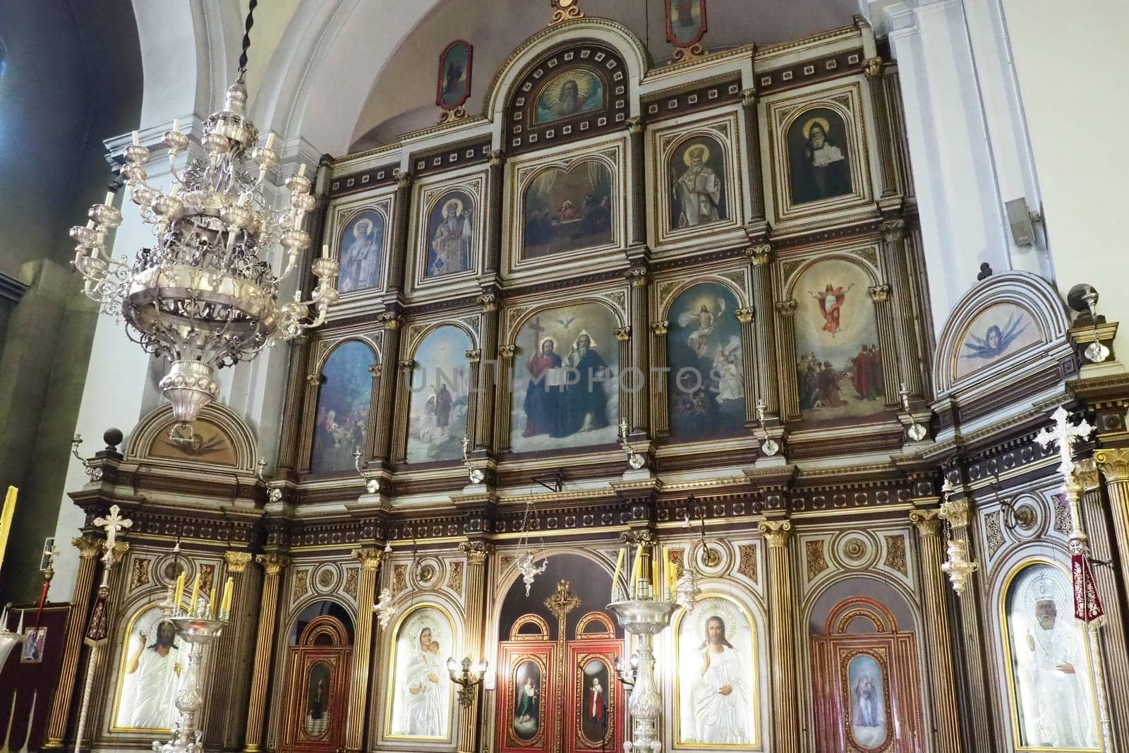 Kotor Montenegro 08.11.22 The Church of St. Nicholas attracts pilgrims tourists. Orthodox center. Interior and decoration of church, altar, icons, candles, chandeliers and antique tiles on the floor