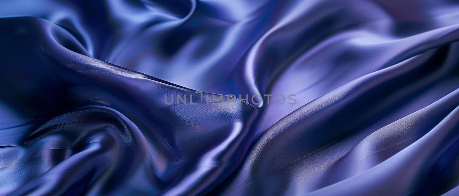 Rippling azure blue satin draped in fluid waves, the light playing across the lustrous folds of the vibrant fabric