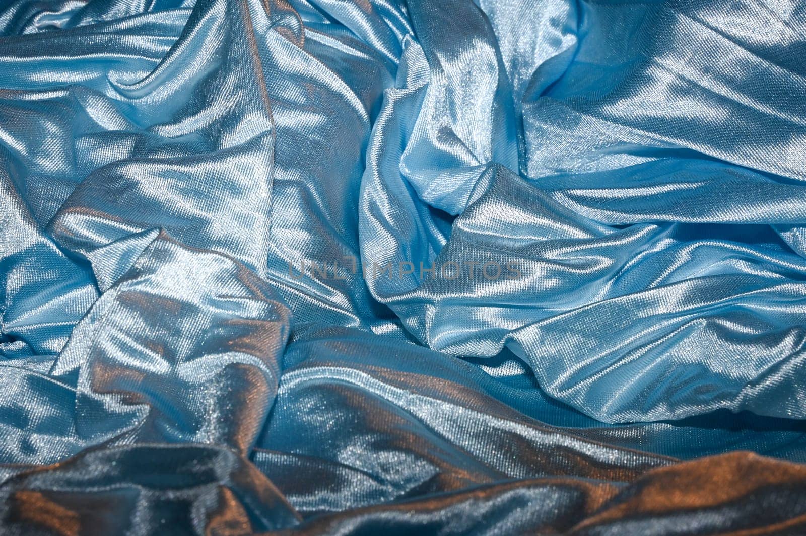 Shiny solid color light blue fabric