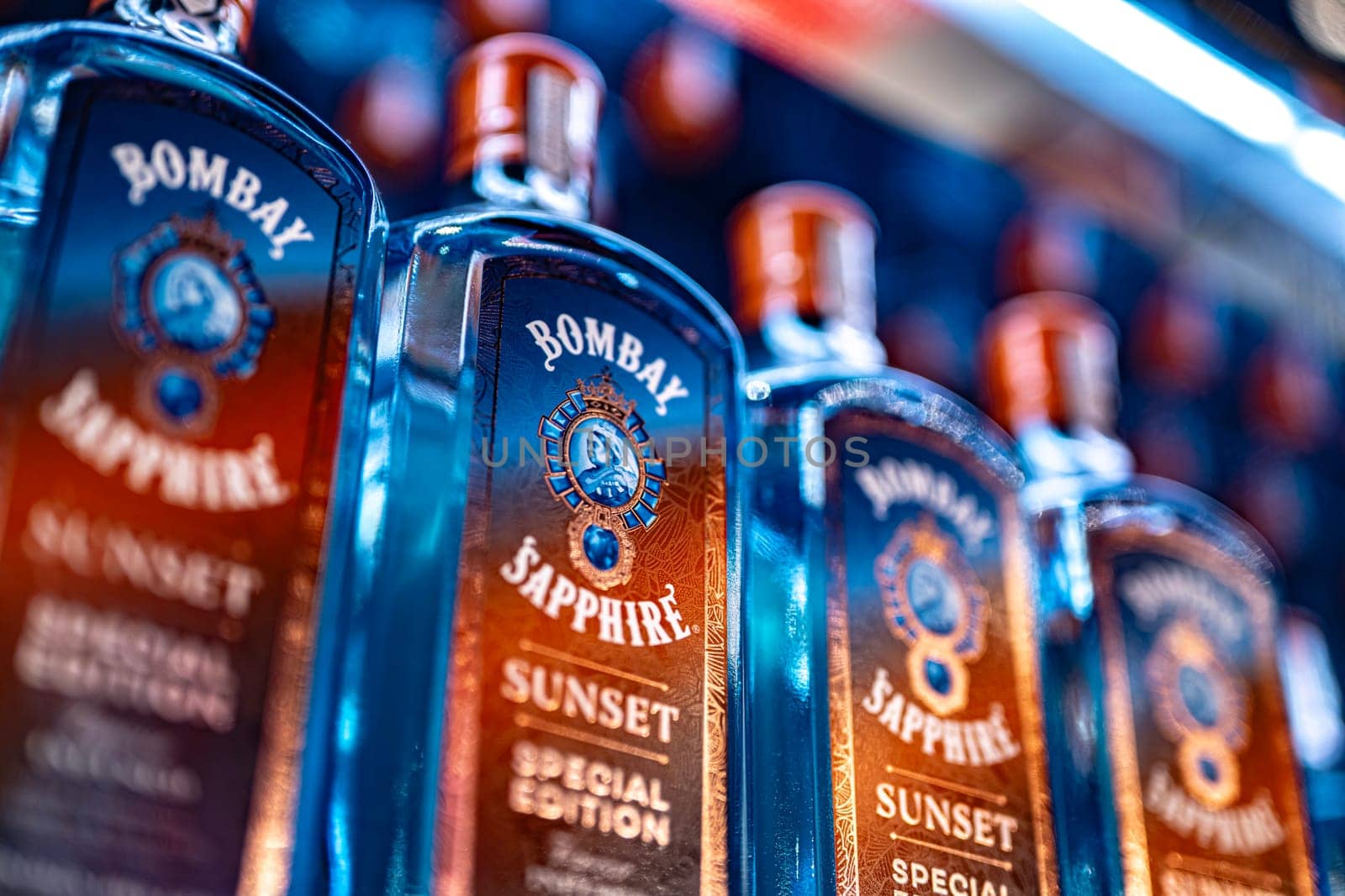 DUBAI, UAE - MAR 22, 2022: Bottles of Bombay Sapphire Sunset special edition gin on a store shelf