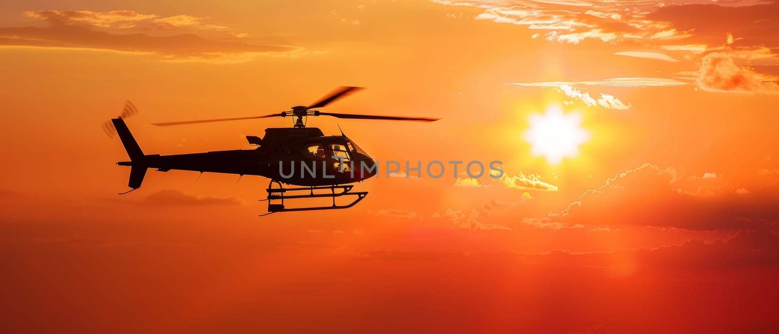 A helicopter in flight is silhouetted against a breathtaking sunset, showcasing the beauty of aviation and nature's backdrop