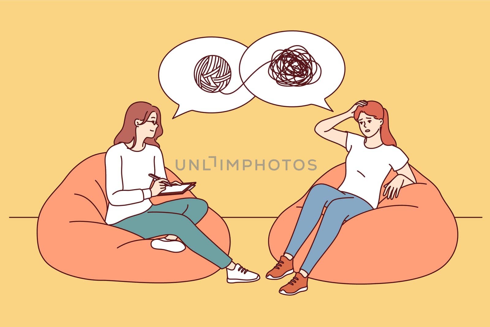 Session of psychotherapist helping girl patient understand confused thoughts and solve psychological problems. Female psychotherapist sits on ottoman opposite woman with mental disorder