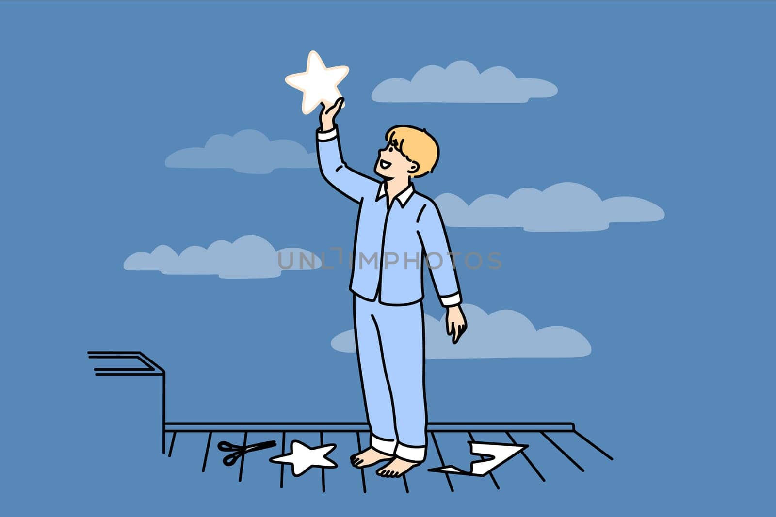 Little boy puts paper star to sky, thinking about endless space and galaxies, dressed in pajamas. Happy child dreams of seeing clean party welcome and wanting to fly into space when grows up
