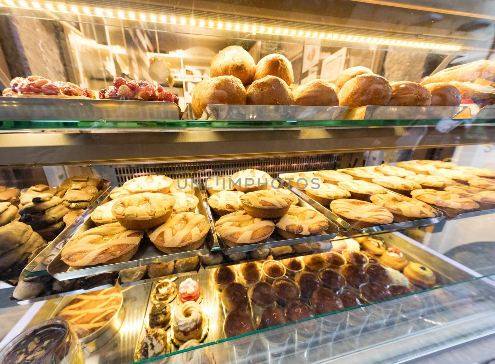 Cakes exposed in neapolitan patissery, Napoli, Italy