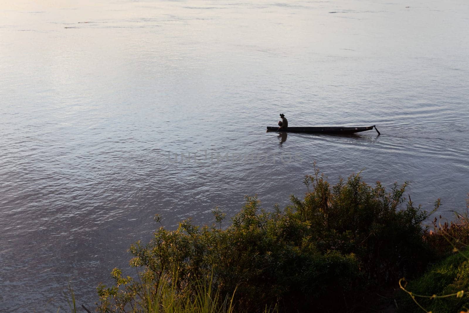 Sunset on Mekong river with fisherman, Laos
