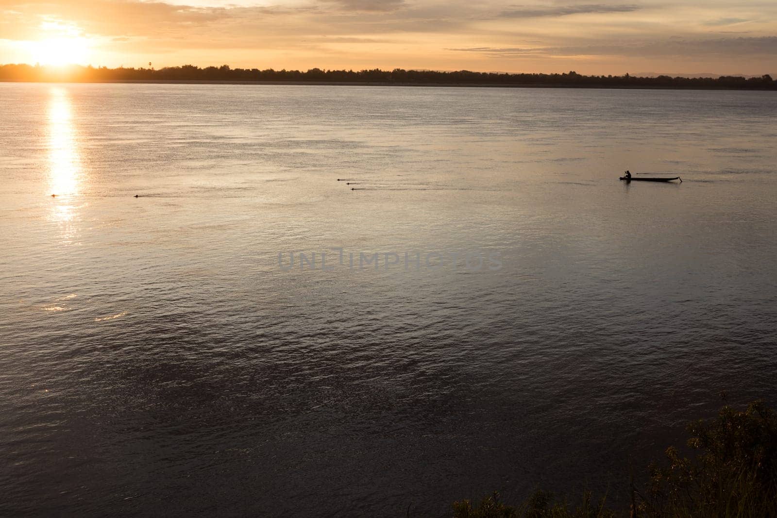 Sunset on Mekong river with fisherman, Laos