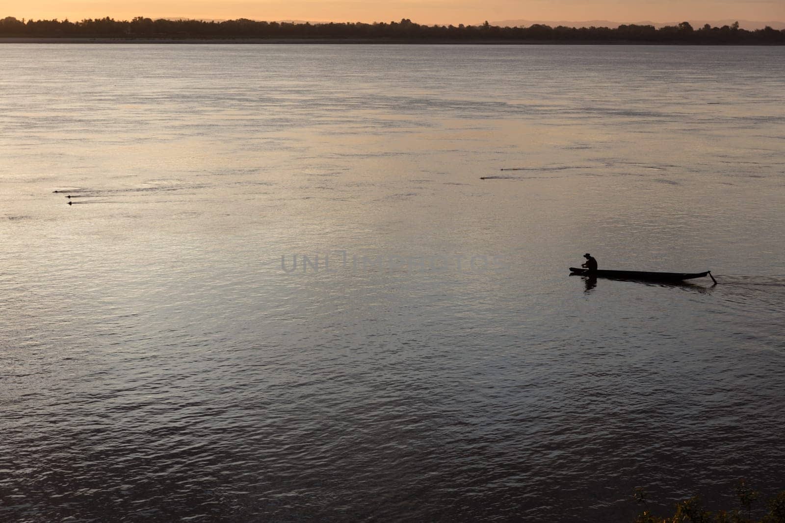 Sunset on Mekong river with fisherman, Laos
