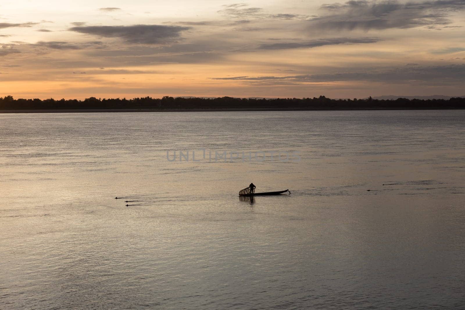 Sunset on Mekong river with fisherman, Laos