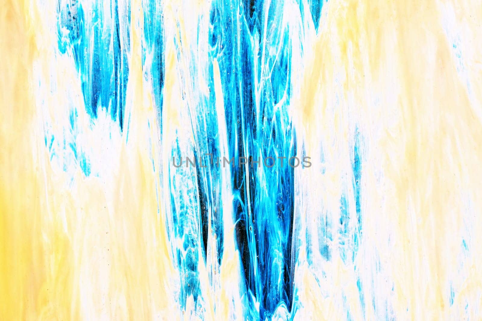 Beautiful decorative handmade creative artistic blue yellow abstract painting. Macro shot of a blue yellow background texture. Art, canvas, pattern. Watercolor paints.