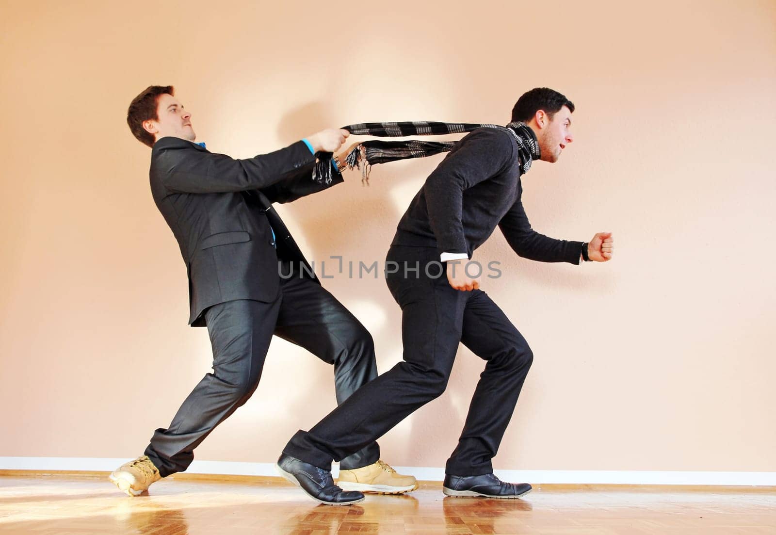 Fun competition. One man tries to stop another with a scarf