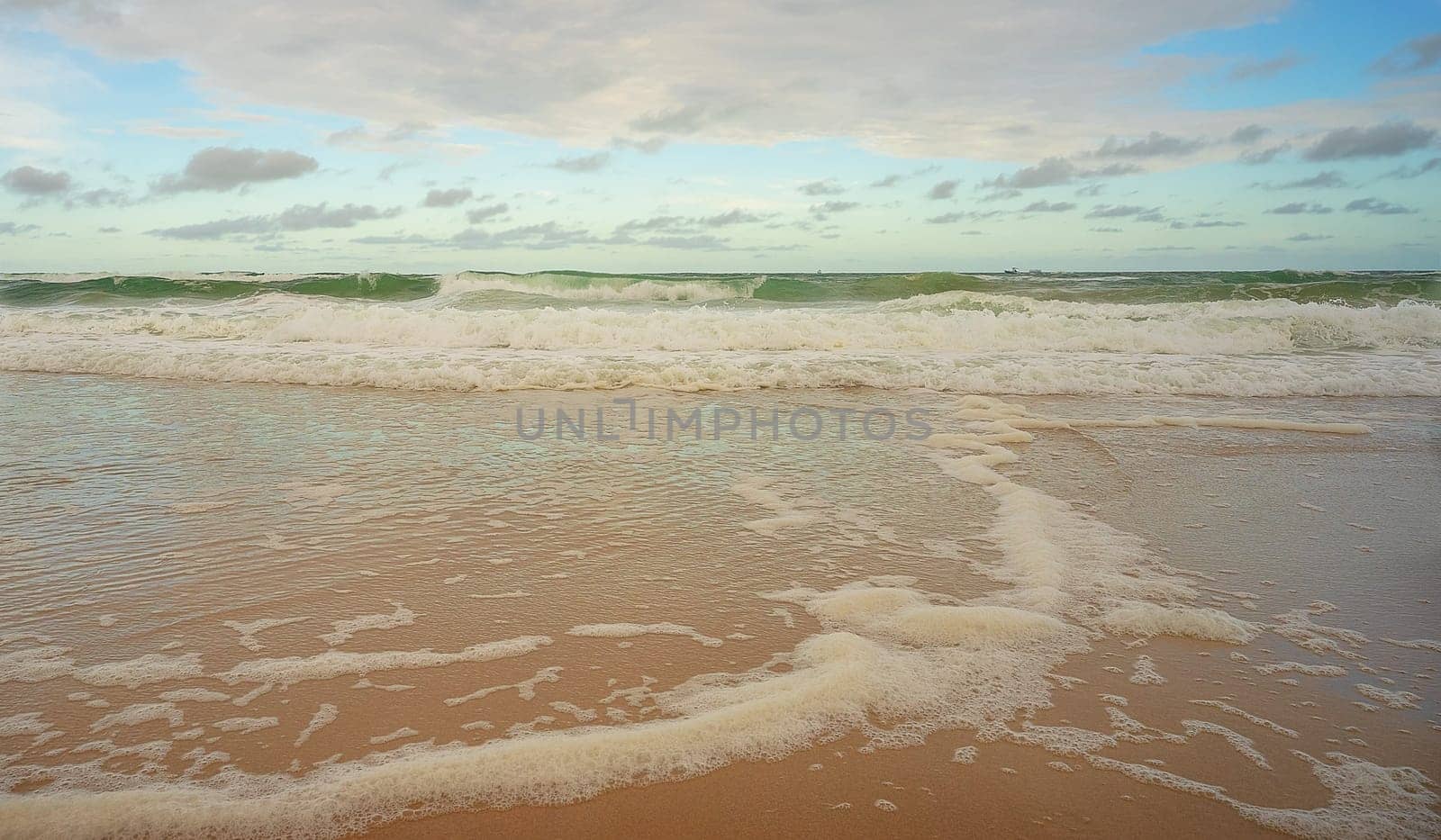 Rough seas and wild surf making lots of foam on waters edge Sunshine Coast Queensland