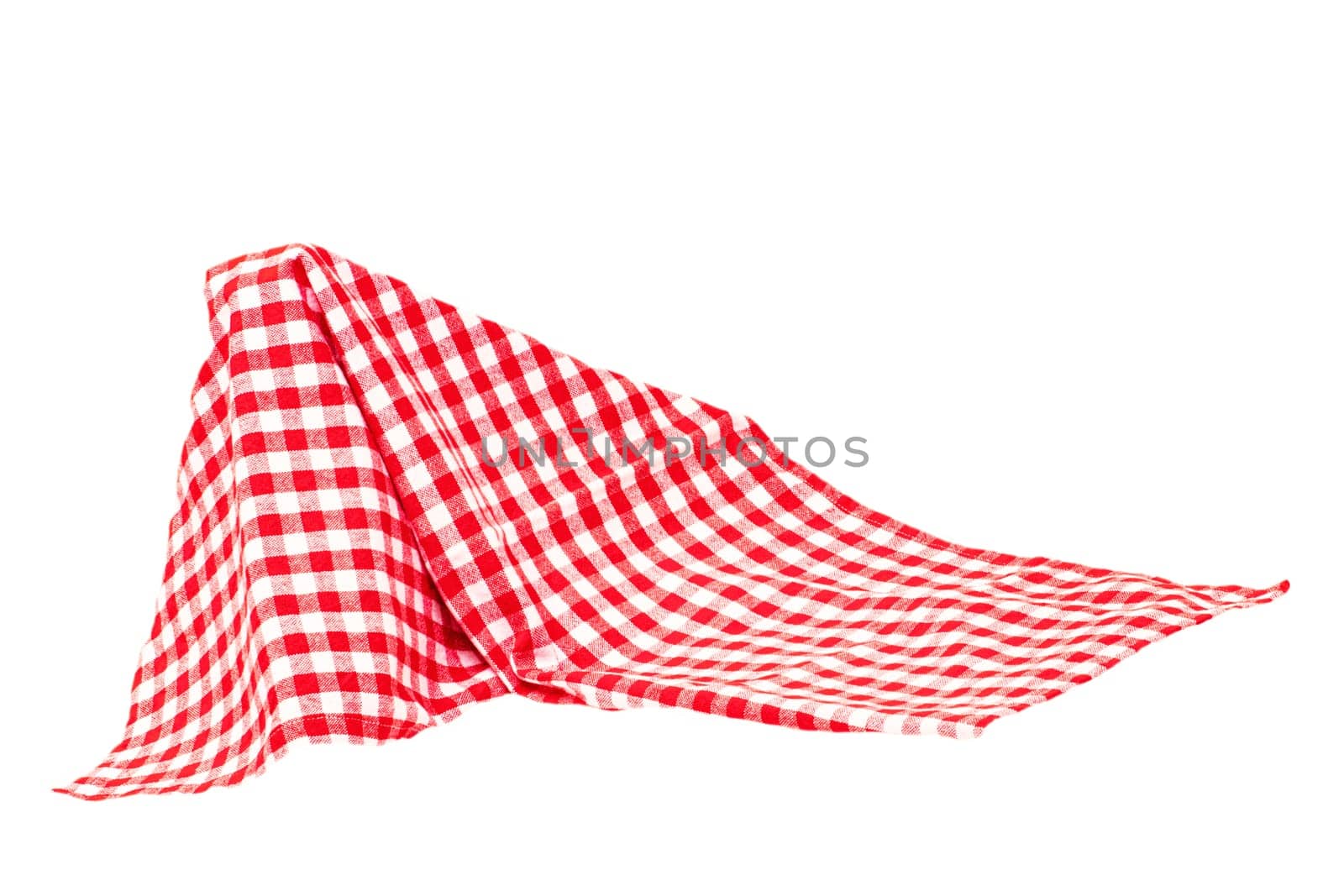 Closeup of a red and white checkered napkin or tablecloth texture isolated on white background. Kitchen accessories. Top view.