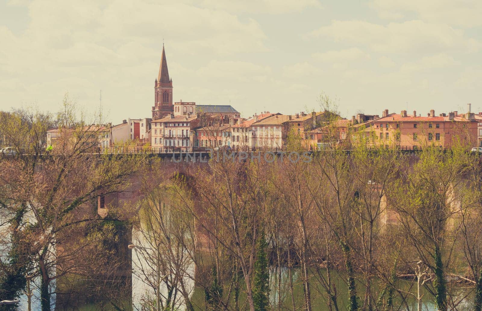 Montauban, France - 03 25 2023 :Overview of the Lot river with old bridge and town, Montauban, Lot, Occitanie, France