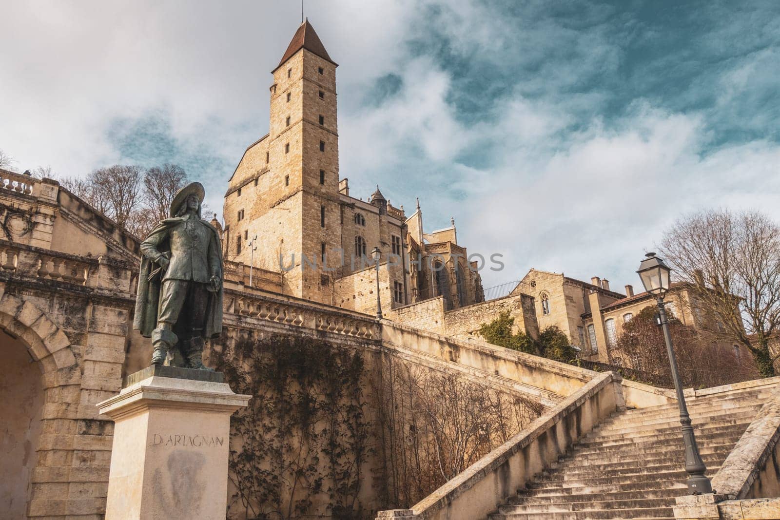 Auch, France - Mars 12 2023: Monumental staircase, statue of d Artagnan and Armagnac Tower, Auch, France