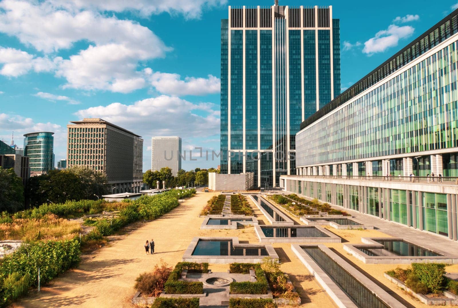 Brussels, Belgium - August 20 2022: Modern glass buildings and botanical garden in Brussels city