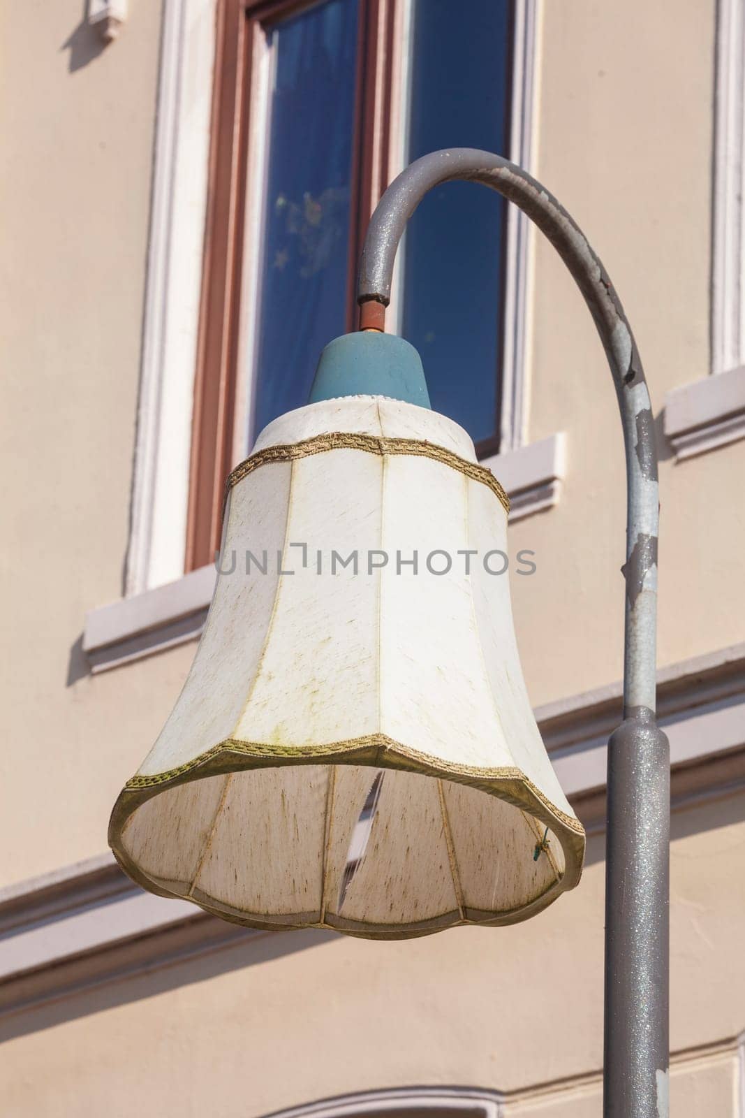 Old lampshade on a lamppost, Germany
