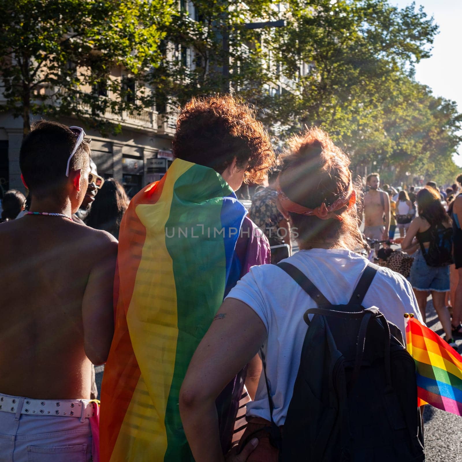 Rear view of LGBT collective sympathizers parading wearing the colors of the rainbow flag. The motto of the Pride 2023 edition was "The Pride of Our Lives,"" with the intention of honoring previous generations who paved the way for members of the collective."