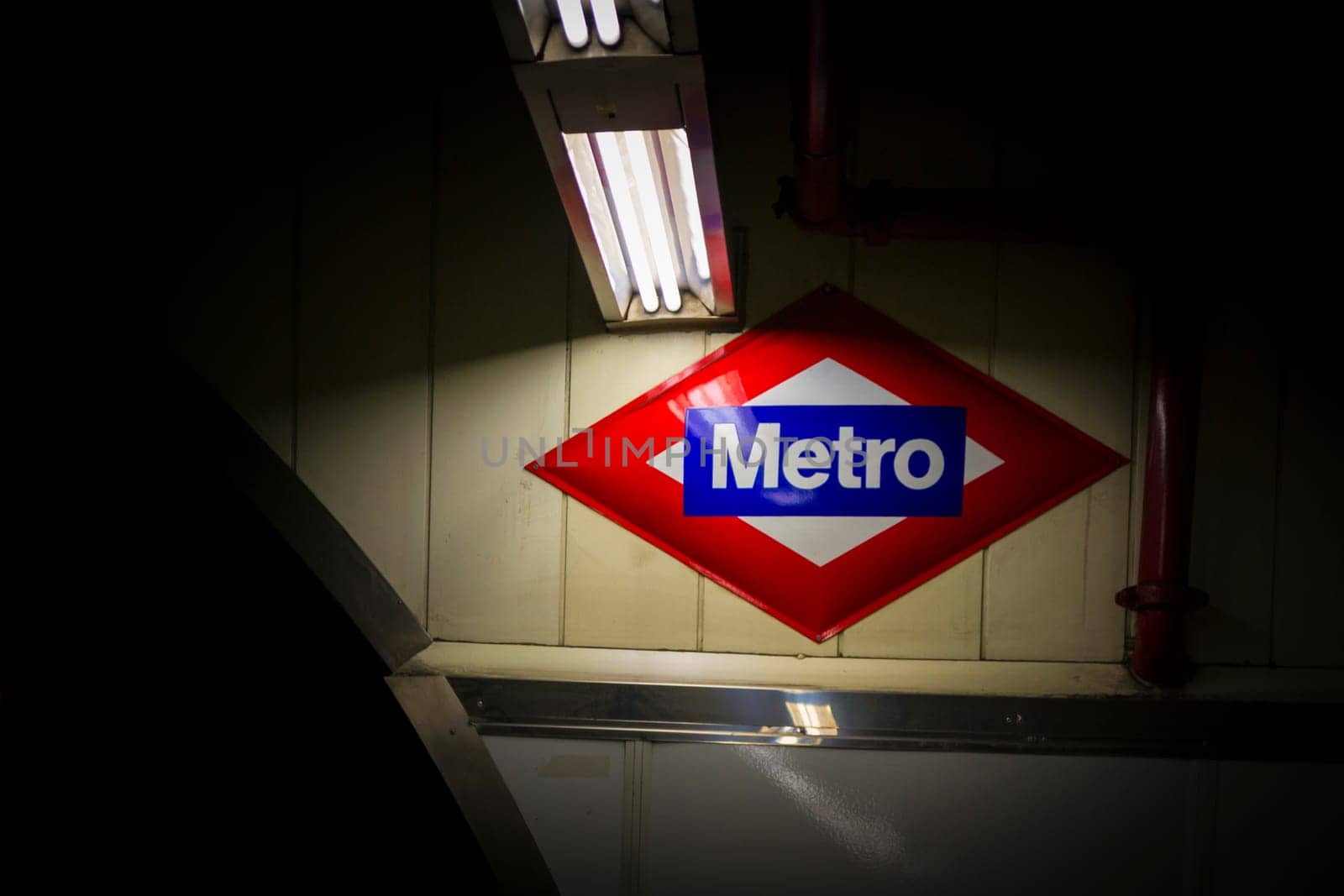Madrid, Spain, May 20th 2012: View on the metro sign and logo in a subway station in Madrid, Spain