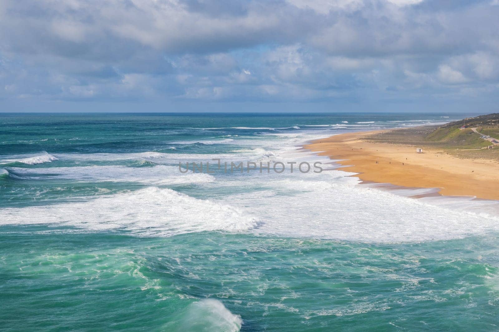 Nazaré 's North beach, Praia do Norte, Nazaré. World record of biggest wave. Beach with rough sea.