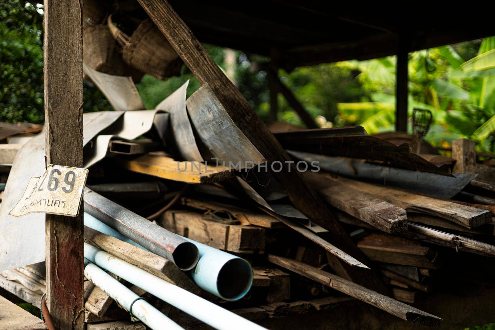 Old wood. Dusty wood chips. Wood for construction a pile of wood lay on the ground.