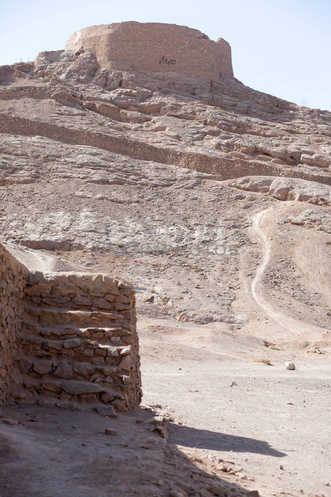 tower of silence , Yazd, Zoroastrian tradition considered a dead body to be nasu, unclean. To preclude the pollution of earth or fire  the bodies of the dead are placed a top a dakhma and so exposed to the sun and to scavenging bird