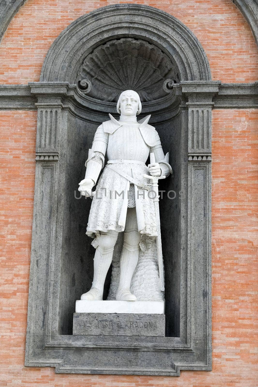 Alfonso D'Aragona statue on facade of the Palazzo Reale. Napoli, Italy