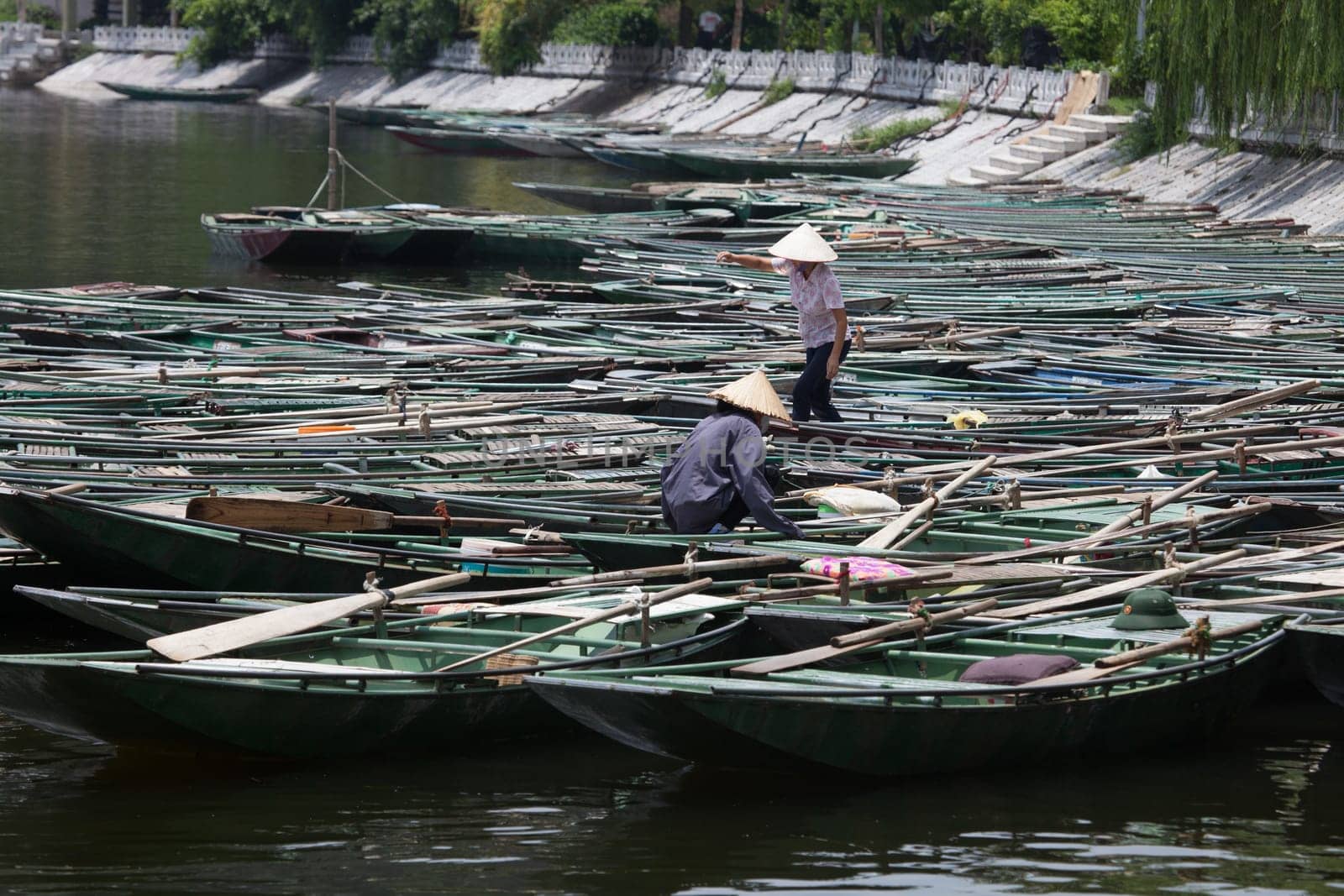 Boating on  the Mekong Delta with concal hats, Vietnam