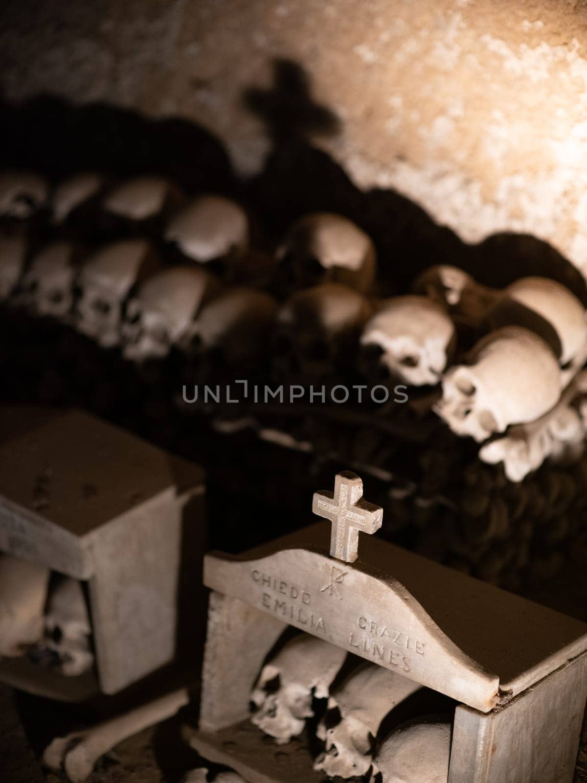 Skull and bones in ancient ossuary, Naples