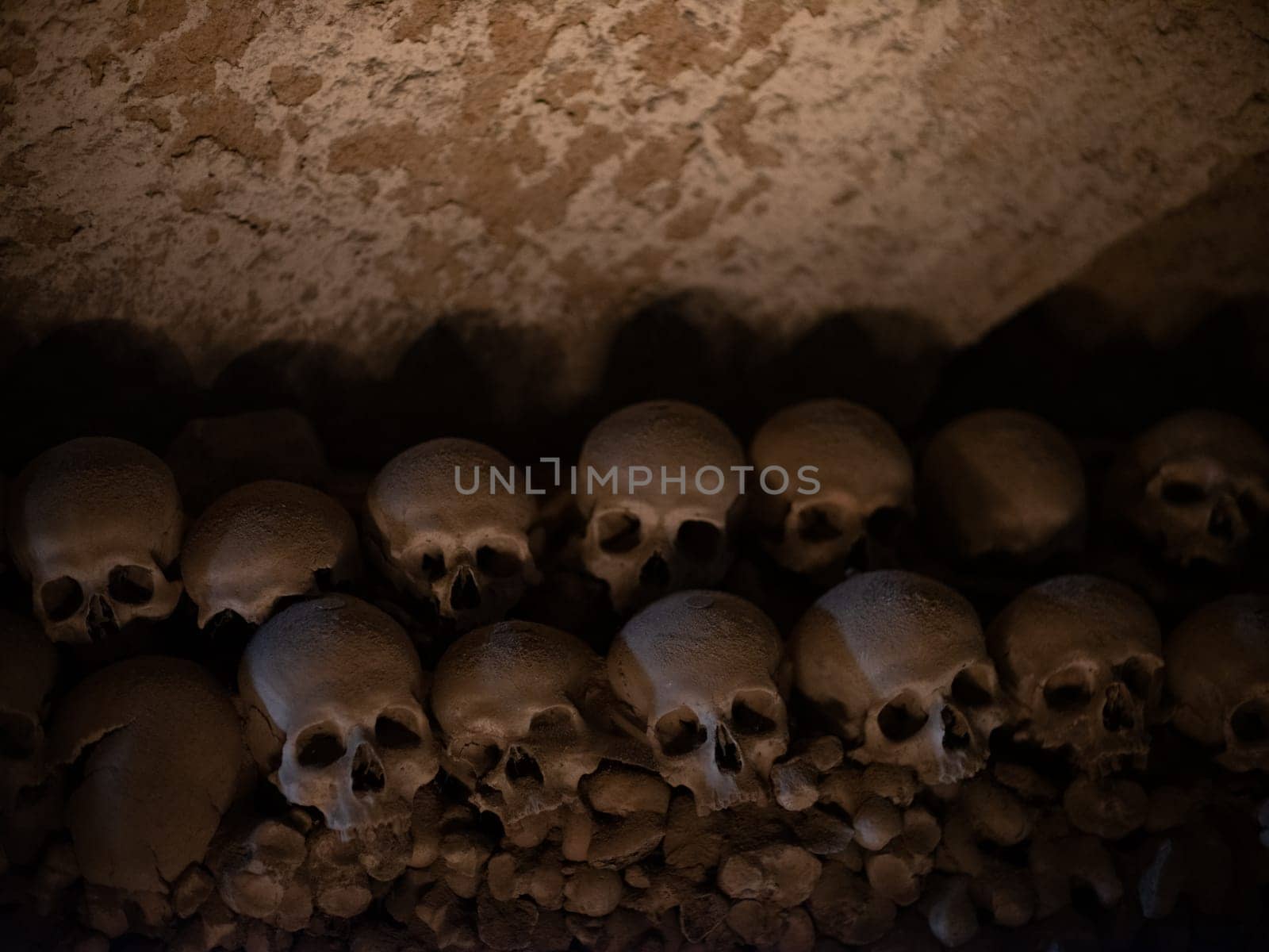 Skull and bones in ancient ossuary, Naples