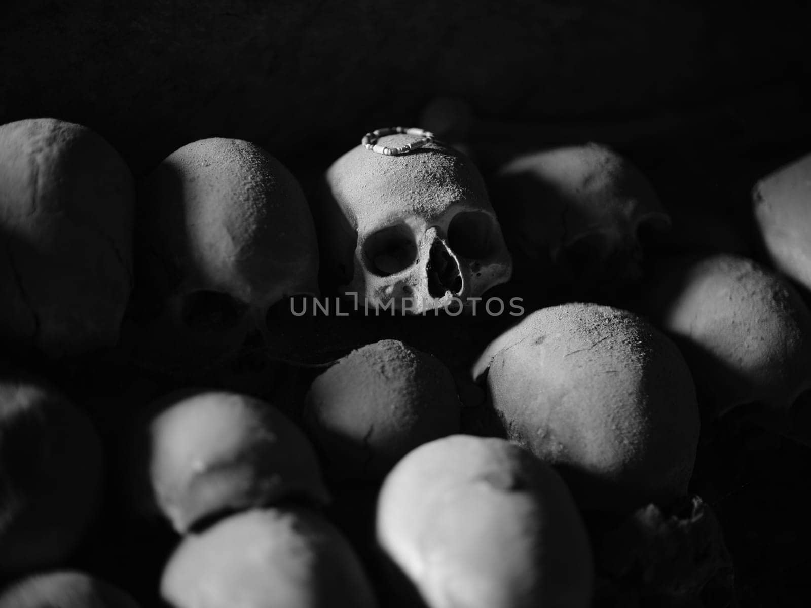Skull and bones in ancient ossuary, Naples