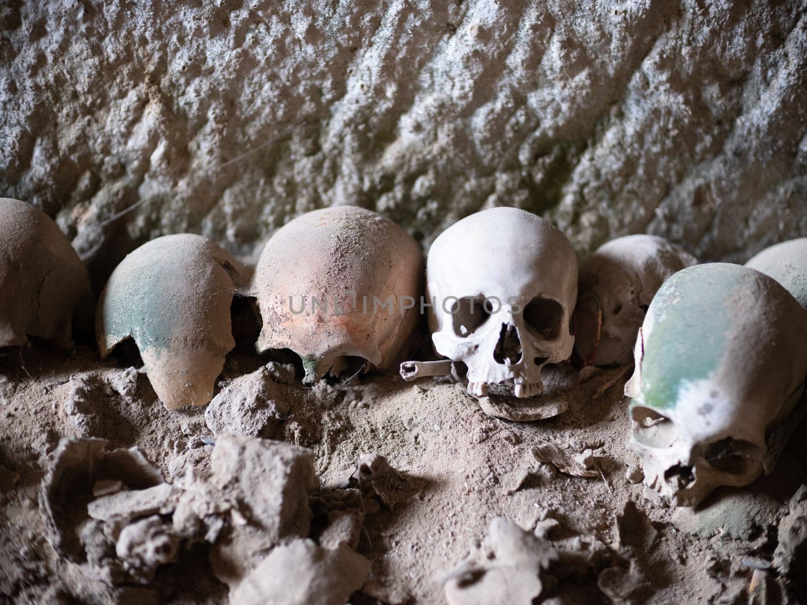 Skull and bones in ancient ossuary, Naples