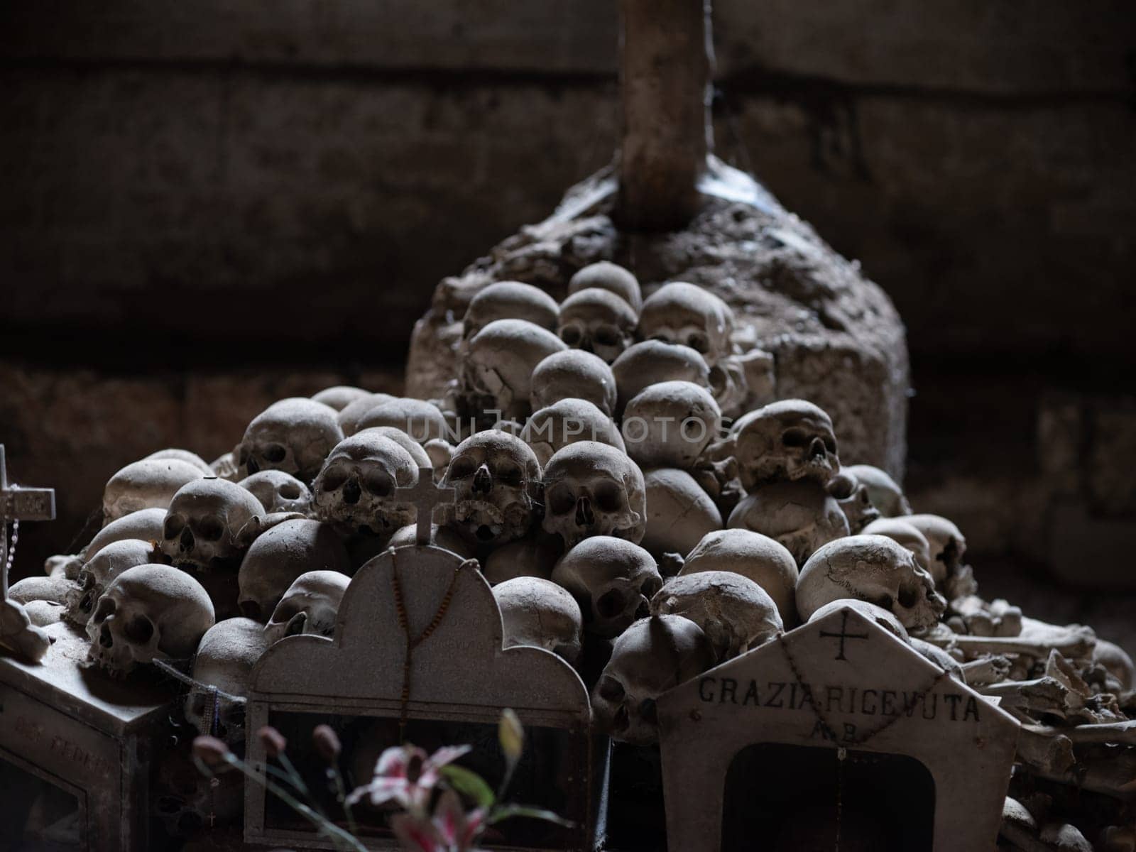 Skull and bones in ancient ossuary, Naples