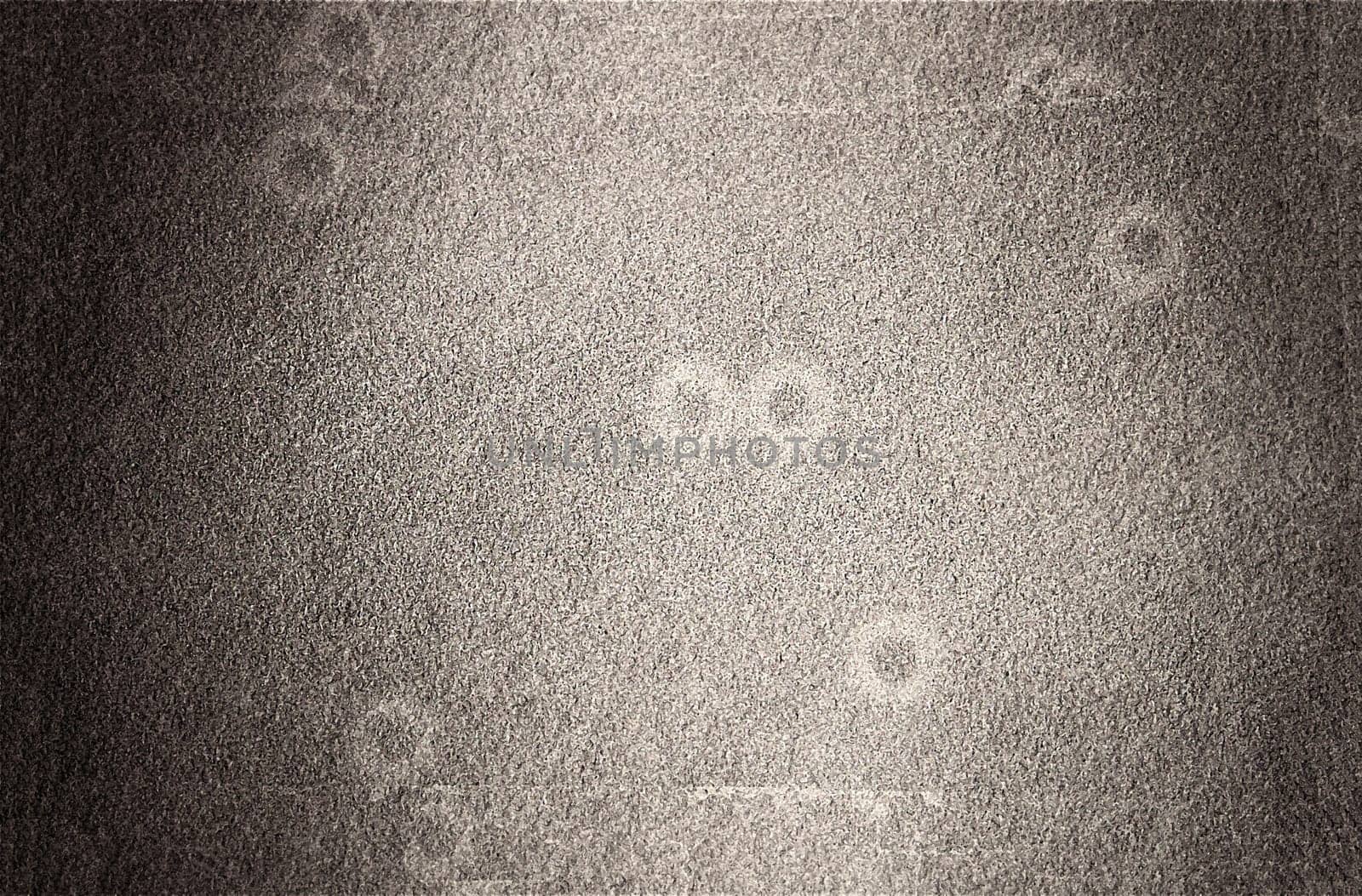 Background of old gray thick paper with spots and roughness close-up view from above
