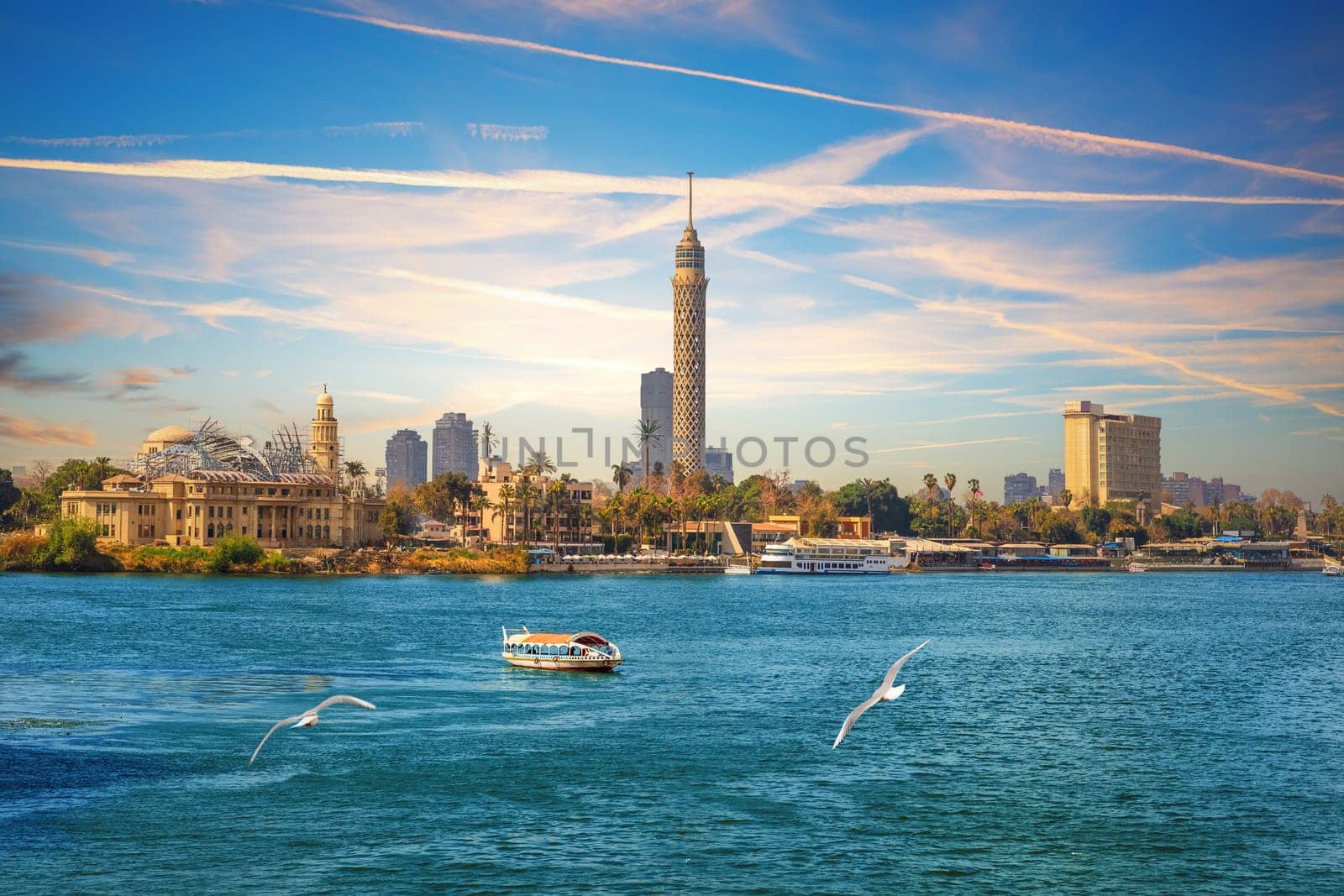 View on the Cairo Tower at sunset in Gezira island in the Nile, Egypt.