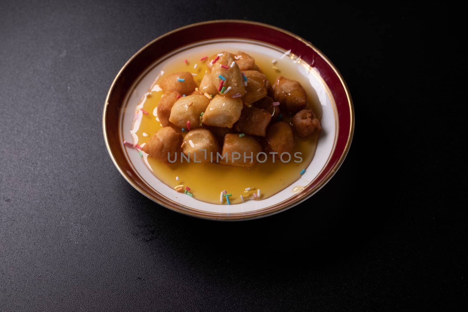 Struffoli - Traditional Neapolitan Dessert Served at Christmas. Honey Glazed, Fried