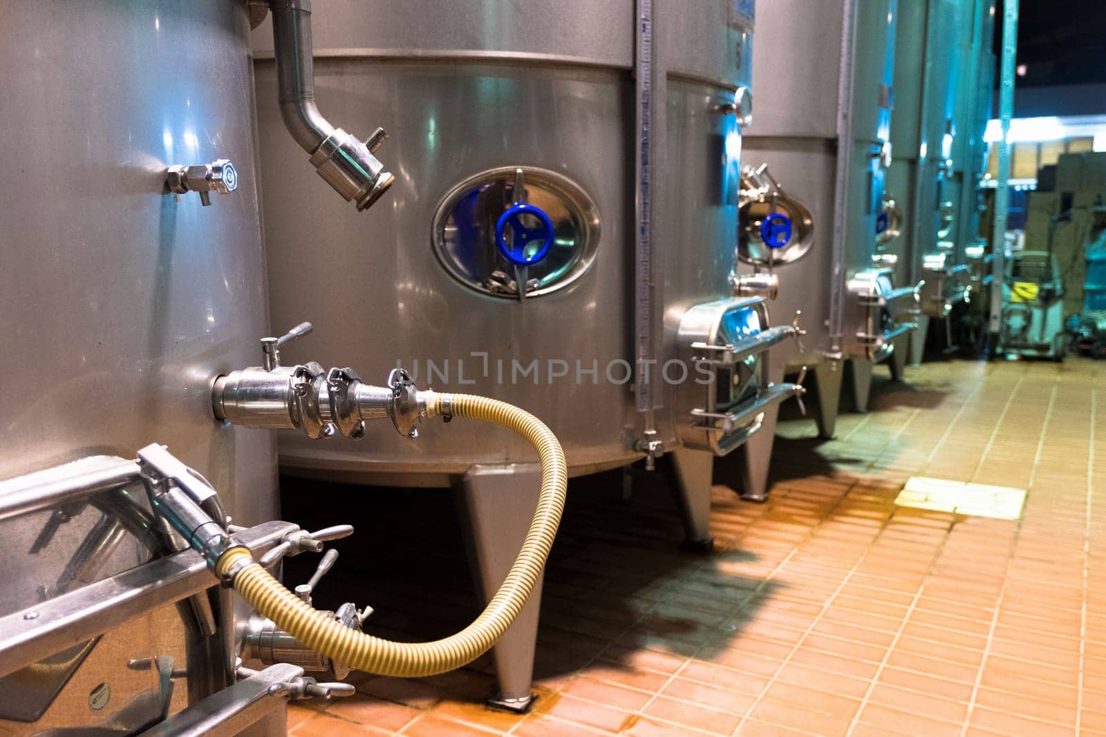 Cellar with an industrial wine production system