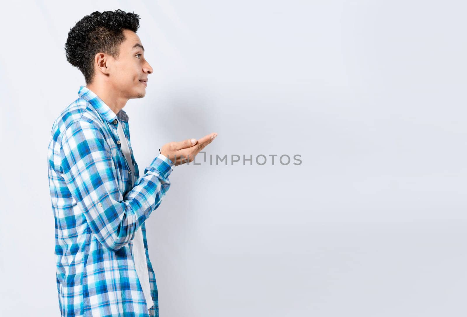 Man recommending an advertisement with the palm of his hands. Guy recommending an ad space isolated, Smiling person recommending a product with his hands