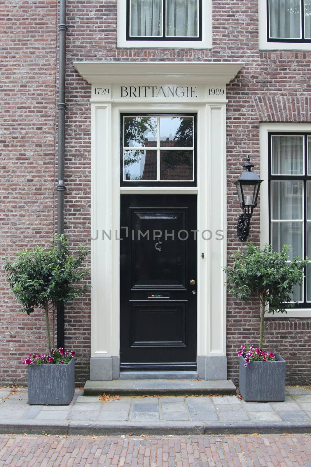 an old, beautifully decorated front door black and white