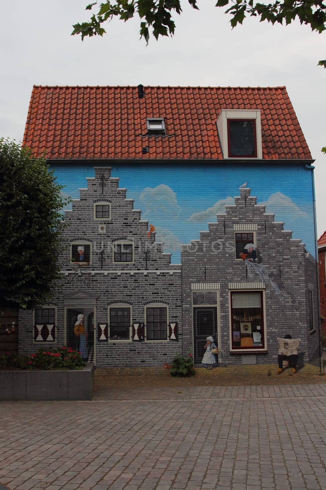 a beautiful graffiti / wall painting of a medieval house in Zierikzee (Zeeland), the Netherlands
