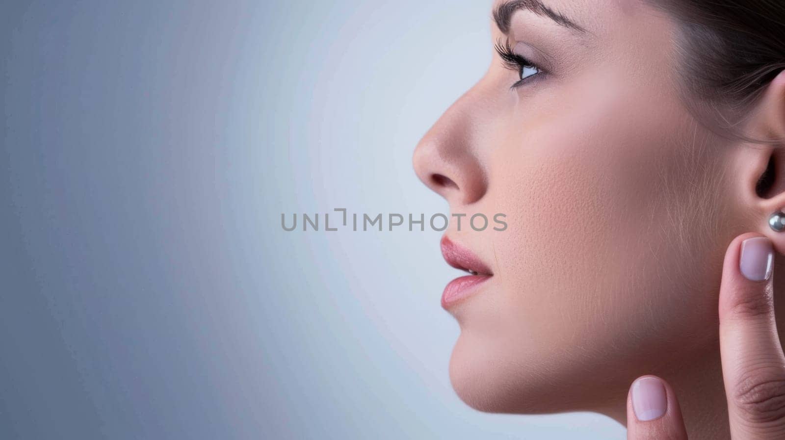 A woman is shown with her hand raised to her ear, indicating she is actively listening or trying to hear something. Her facial expression suggests concentration or focus on the sound.
