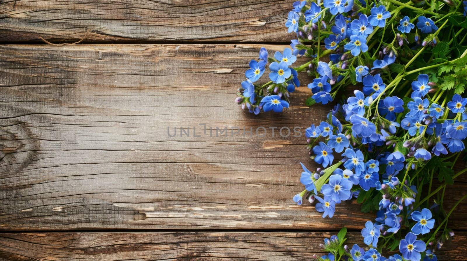 A cluster of vibrant blue flowers arranged neatly on a rustic wooden table. The petals and stems bring a pop of color to the simple setting.