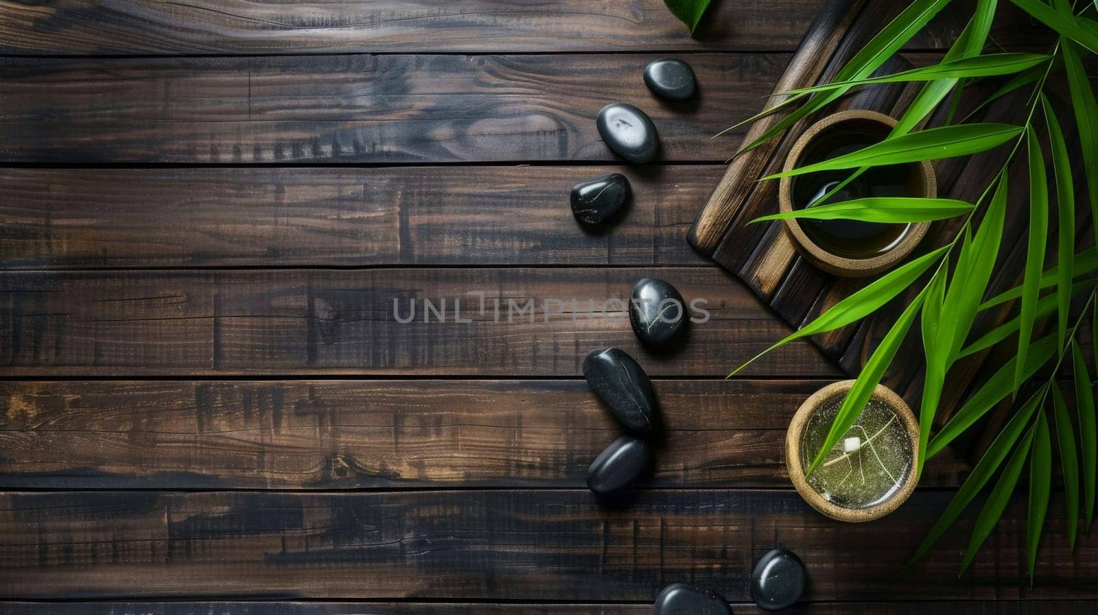 A wooden table is displayed with black stones neatly arranged on top. Among the stones sits a vibrant green plant, adding a pop of color to the composition.